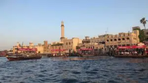 Al Seef Dubai waterfront with traditional Arabian architecture along Dubai Creek at sunset
