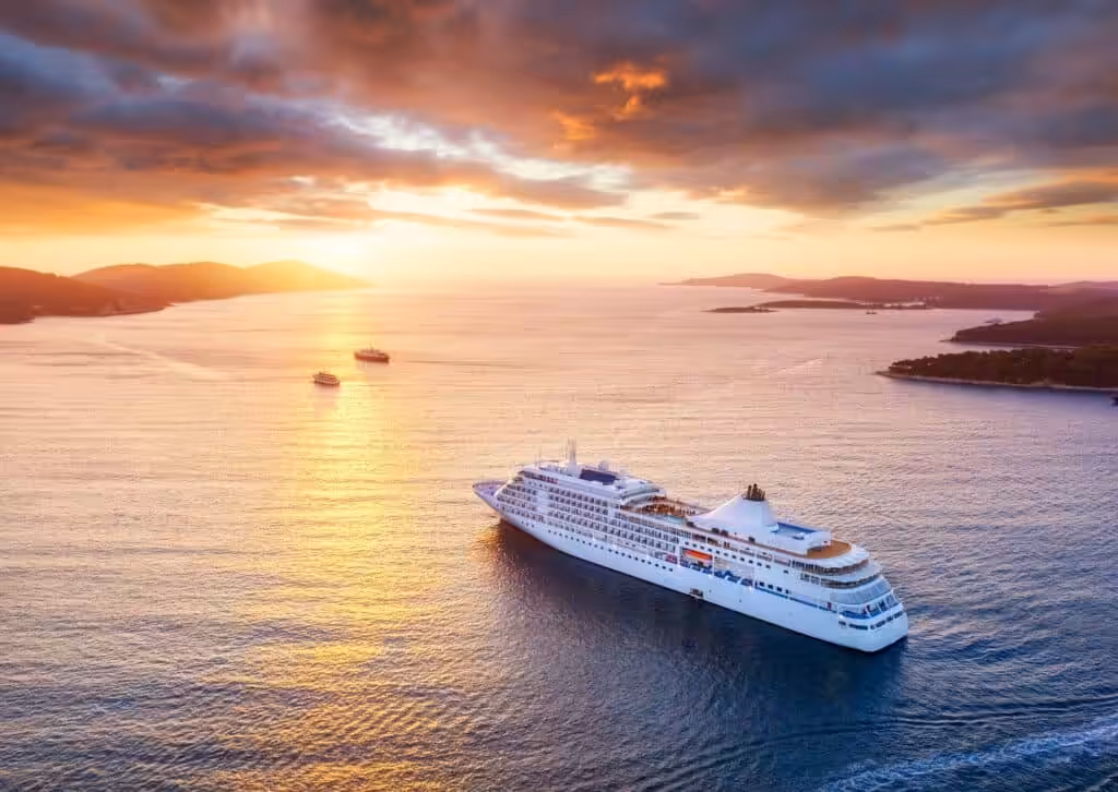 Aerial view of a cruise liner off the Croatian coast during sunset.