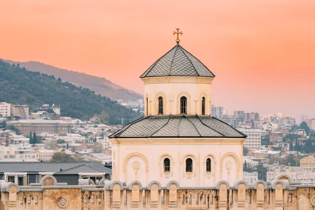 Holy Trinity Cathedral in Tbilisi, Georgia with Caucasus landscape