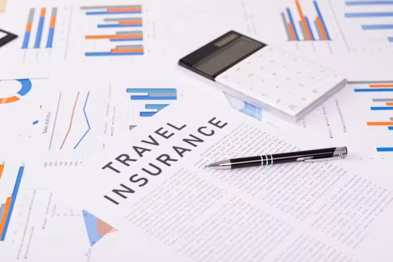 Symbolic image for safe travel with passport, shield icon, insurance documents, and miniature airplane on a table.