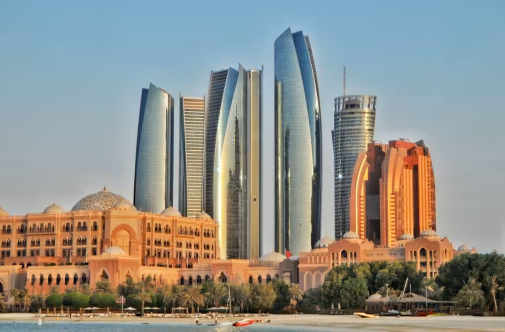 Panoramic view of Abu Dhabi’s Emirates Palace with modern skyscrapers in the background