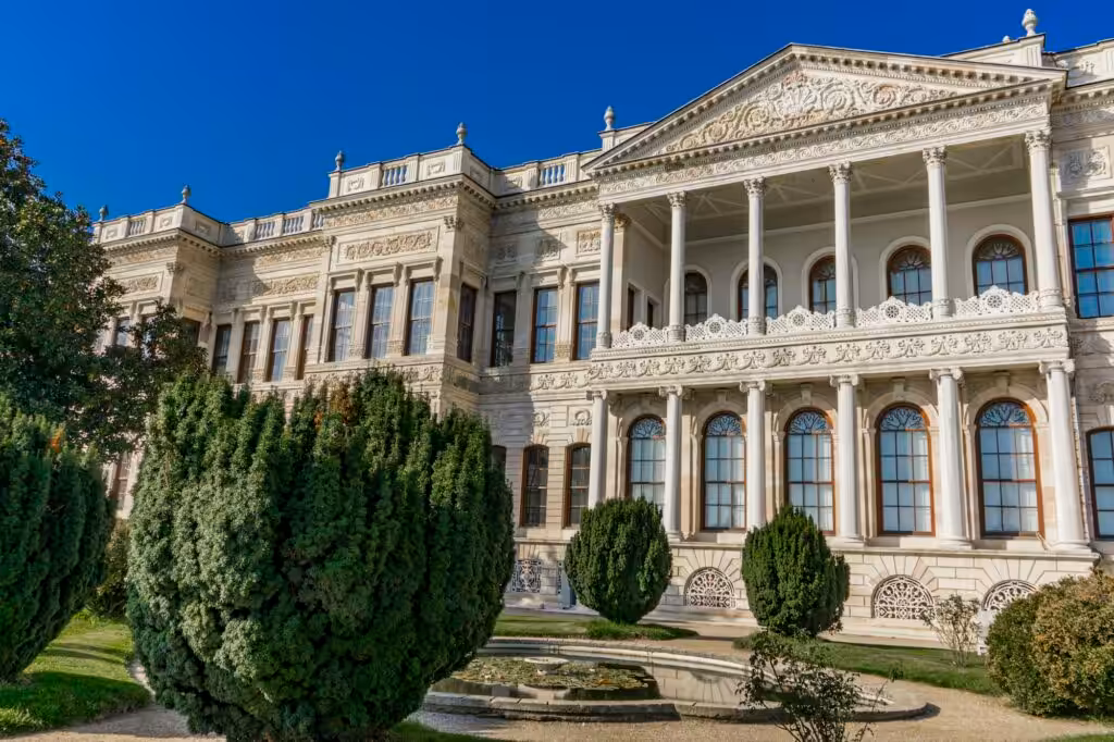 Dolmabahçe Palace in Istanbul, Turkey, with its ornate façade along the Bosphorus shoreline.