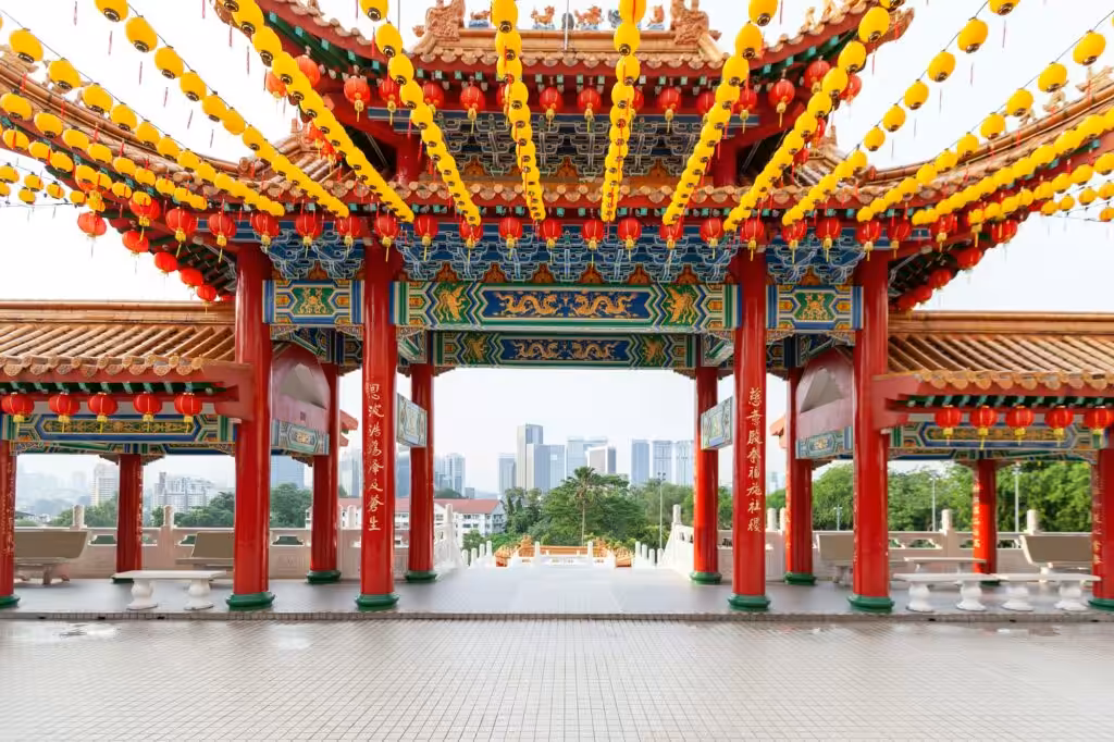 Thean Hou Temple in Kuala Lumpur, Malaysia, with traditional Chinese architecture and red-tiled roofs.