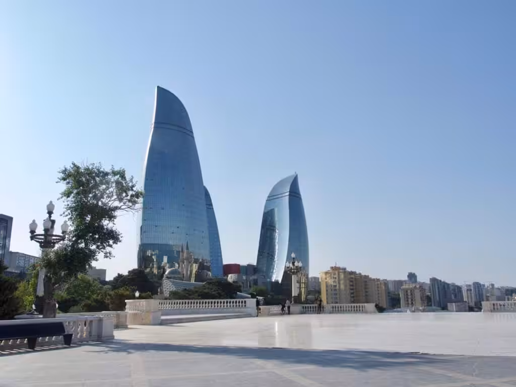 Modern skyline of Baku featuring the iconic Flame Towers and contemporary urban architecture