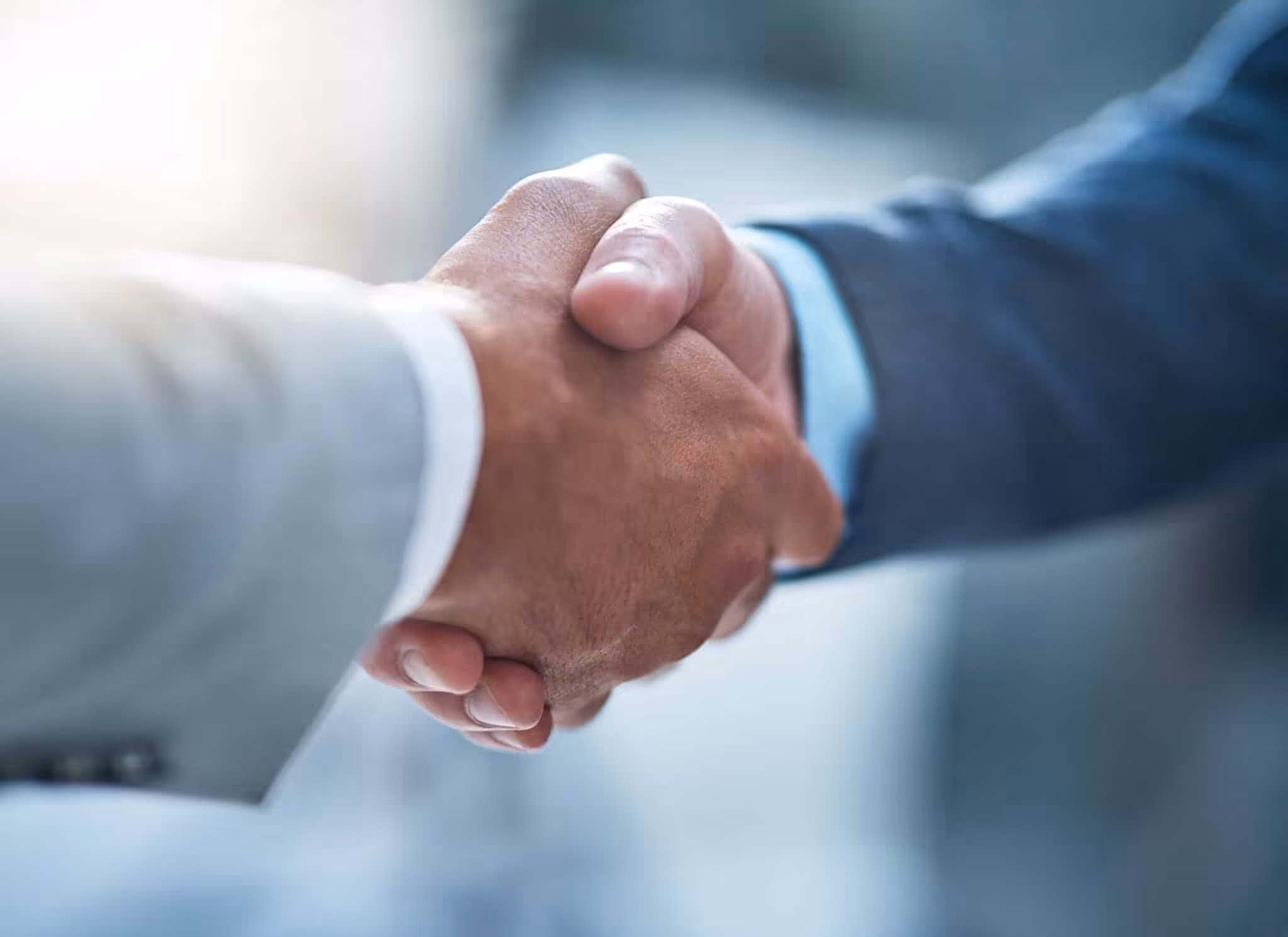Business handshake between two professionals symbolizing trust and partnership