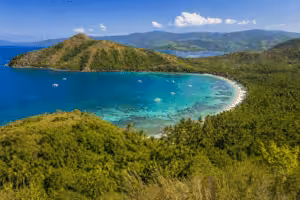 Aerial view of Mindoro island coastline with turquoise water, tropical beach and lush green landscape in the Philippines