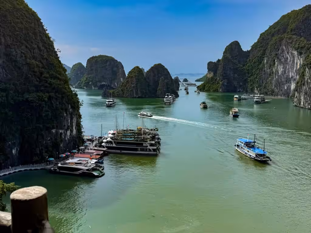 Tour boats among limestone karst islands in Ha Long Bay, Vietnam