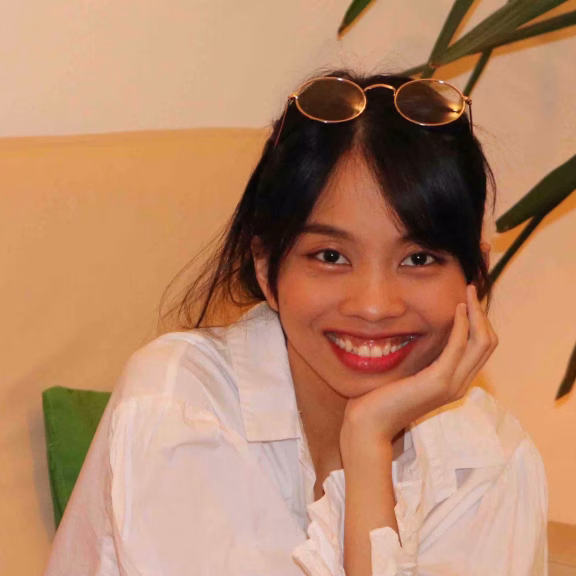 Patricia, COO of Avyra Travel, in conversation in a modern office setting.