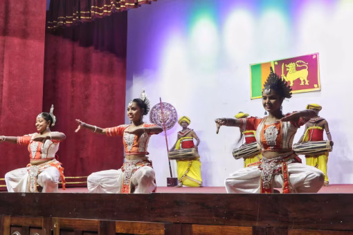 Traditional Sri Lankan dancer group performing in colorful costumes