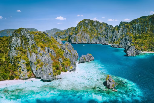 Aerial view of limestone cliffs and turquoise lagoons in El Nido, Palawan, Philippines